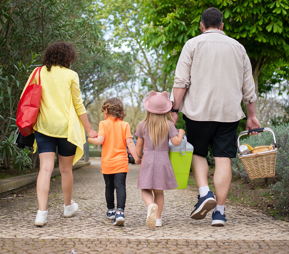 family of four walking outside